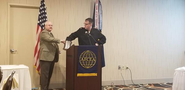 At the chapter's December luncheon, Neil Bourassa, chapter president, asks Capt. Grady to pull a raffle winner. 