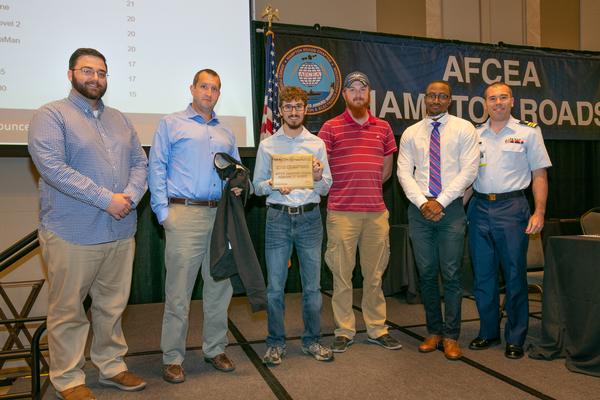 NAVSEA Red Team (Seart), HackWarz winners, are presented with awards at the June event. 
