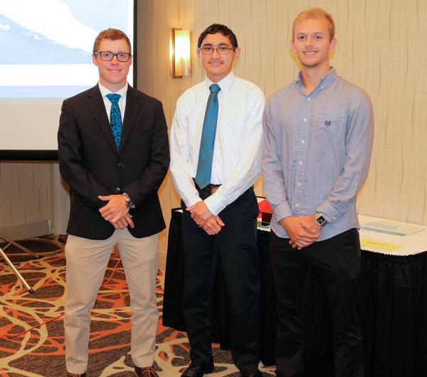 Recipients of the 2019 STEM Scholarship, Dreugh Phillips, Gerry Fernandez III, and Nick Markland, pose for a photo at the July event.