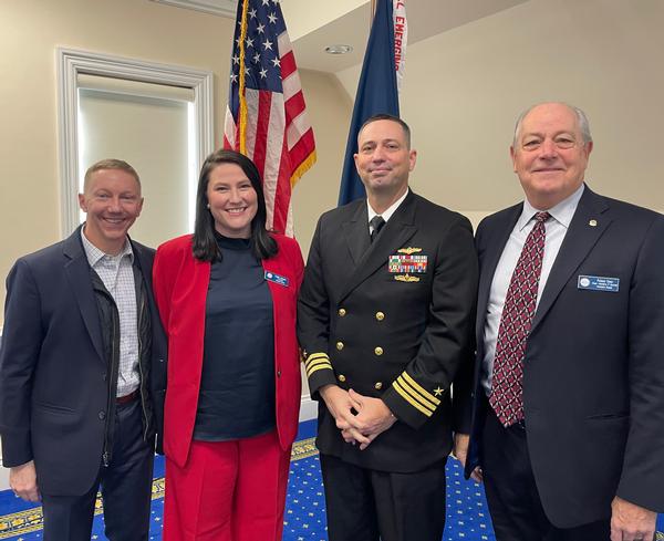 Pictured (l-r) are Eric Johnson, chapter vice president of programs; Johnson; Cmdr. Nick Goddard; Palmer Sims, regional vice president and past president.