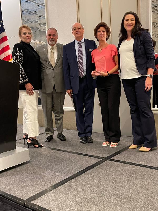 The chapter awards Palmer and Theresa Sims with an Outstanding Achievement award for the success of the 2022 Maritime IT Summit held in conjunction with the annual Department of the Navy Chief Information Officer training event in Norfolk.