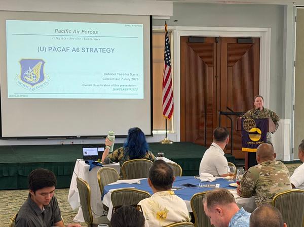 Col. Tassika Davis, USAF, director, Cyber Operations and Warfighter Communications, Pacific Air Forces, delivers the keynote at the chapter's July luncheon.