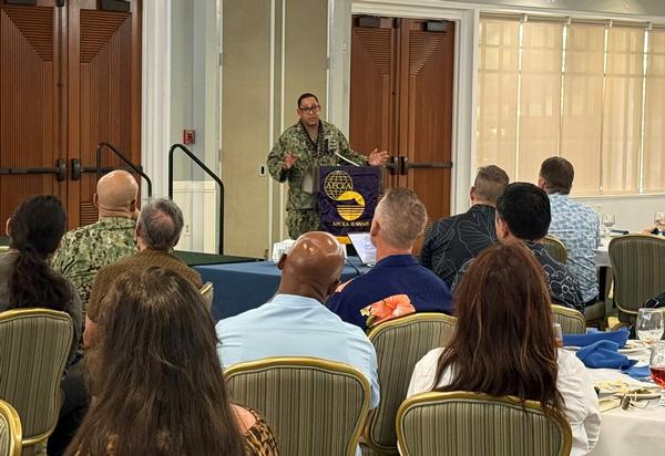 Capt. Victor Taylor, USN, director, C4 and Cyber Directorate, Headquarters Pacific Fleet, presents at the August event.