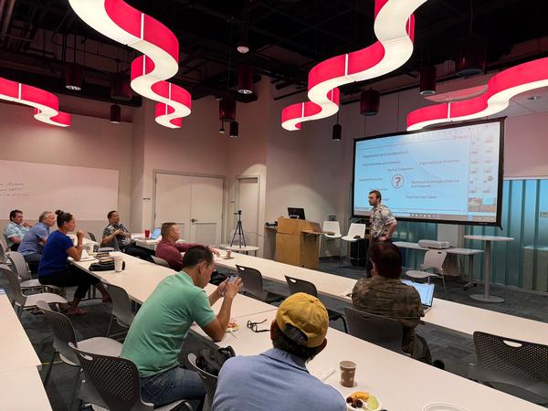 The audience enjoys presentations during the Tech Talk event in May.