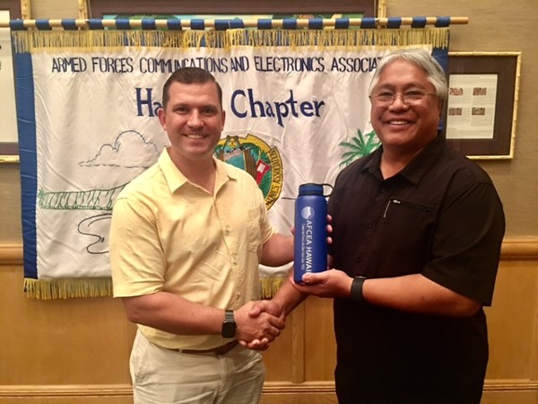 Chapter President Jim Muller (l) thanks March guest speaker Jicky Ferrer of the Defense Intelligence Agency.