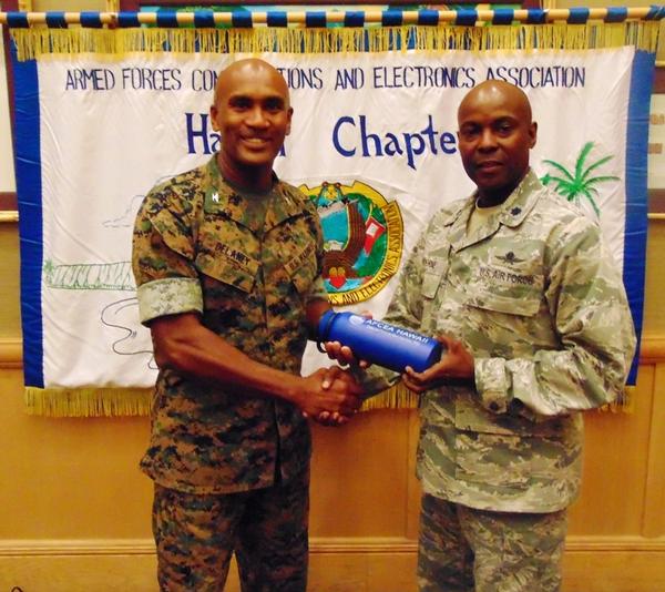 Lt. Col. Callistus Elbourne, USAF (r), chapter president, presents a token of appreciation to the chapter's October guest speaker, Col. Joseph Delaney, USMC, Defense Information Systems (DISA) Pacific Field Command (PAC) commander.