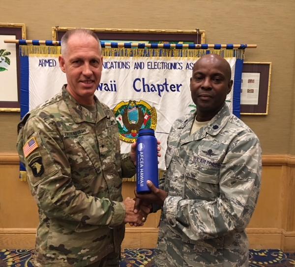 Chapter President Lt. Col. Callistus Elbourne, USAF (r), presents a token of appreciation to January guest speaker Brig. Gen. Paul Fredenburgh, USA, director, command, control, communications and cyber (C4) for U.S. Pacific Command.