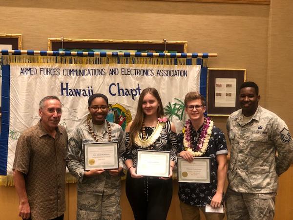 At the May event, Jeff Bloom (far l), chapter president, and Master Sgt. Shamar Jones, USAF (far r),  vice president of awards, present awards to AFCEAN of the Month recipients (l-r) Senior Airman Aliyah Robinson, 690th Cyberspace Operations Squadron, Maksym Zabolotnyy and Kanita Sabotic.
