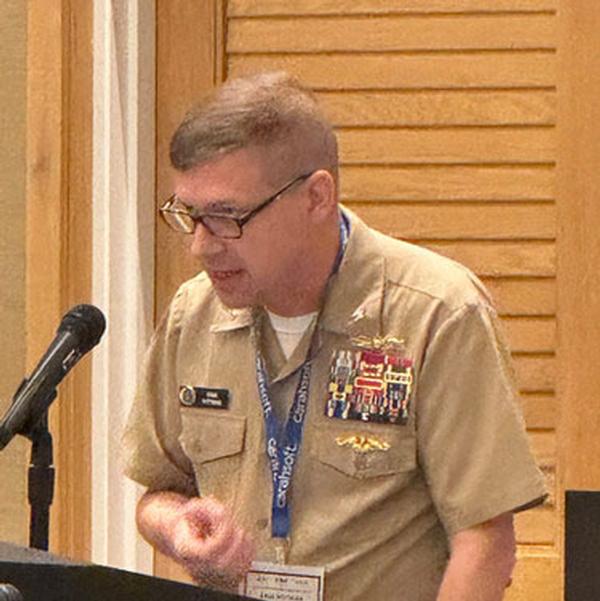 Capt. Erik Pittman, N6, U.S. Pacific Fleet, presents at the October event.