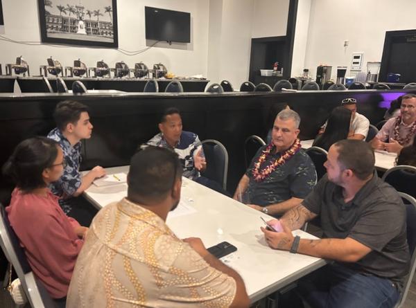 Greg Hester, CEO, Ulu HI-Tech (pictured wearing a lei), mentors others at the March event.