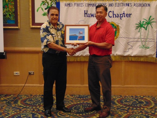 Chairman of the Board Cory Lindo recognizes Barry Fong for his services as chapter vice president of programs at the August luncheon.