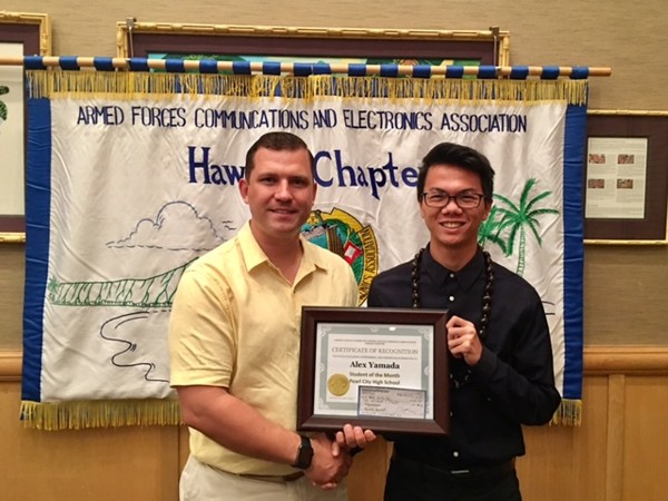 Muller honors Student of the Month Alex Yamada of Pearl City High School at the March chapter luncheon.