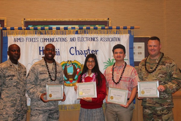 At the April luncheon, Chapter President Lt. Col. Callistus Elbourne, USAF (l), recognizes (from 2nd to l) Staff Sgt. Cory Habersham, USAF, Young AFCEAN of the Month; Student of the Month Krista Chang of St. Andrew's Priory; Student of the Month Tyler Wilfarht of Kailua High School; and Col. Jason Winterle, USA, Senior Government Leader of the Month. 