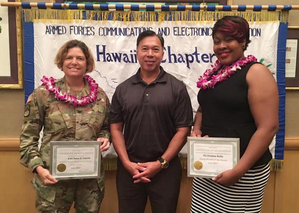 Col. Claire Cuccio (l), chief of staff, 311th Signal Command (Theatre), is recognized as Senior Government Leader along with Fong and Young AFCEAN of the Month IT1 Ermine Bulls, NCTAMS PAC, at the chapter's June event.