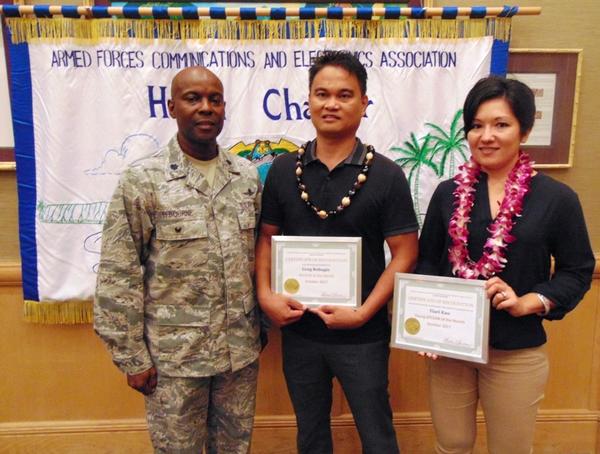 Col. Elbourne (l) presents certificates to Greg Rebugio, AFCEAN of the Month, and Tiari Kau, Young AFCEAN of the Month, at the chapter's October luncheon.