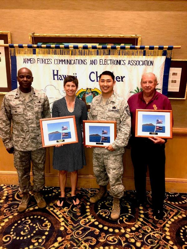 Col. Elbourne (l) thanks chapter volunteers in May for their service, including (from 2nd from l) Christine Lanning, outgoing treasurer, Tech. Sgt. Angel Olivas, outgoing vice president of membership, and E.B. Lawson, public relations vice president.   