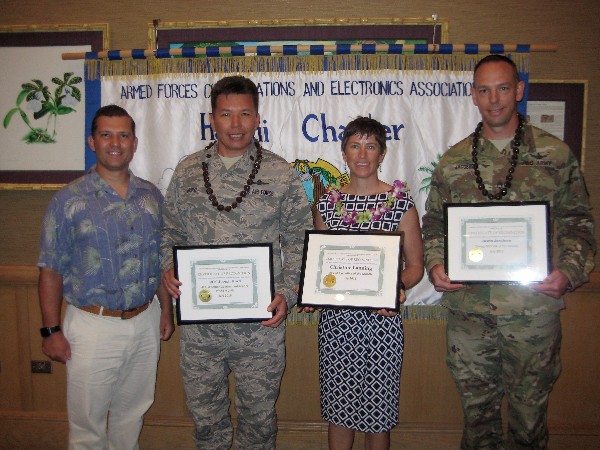 Muller (l) presents awards in July to (from 2nd to l) Lt. Col. Joseph Hurd, USAF, Defense Information System Agency Pacific Command, the Senior Government Leader of the Month; Christine Lanning, Integrated Security Technologies, Executive of the Month; and Sgt. 1st Class Justin Jacobsen, USA, Regional SATCOM Support Center, Pacific, Young AFCEAN of the Month.