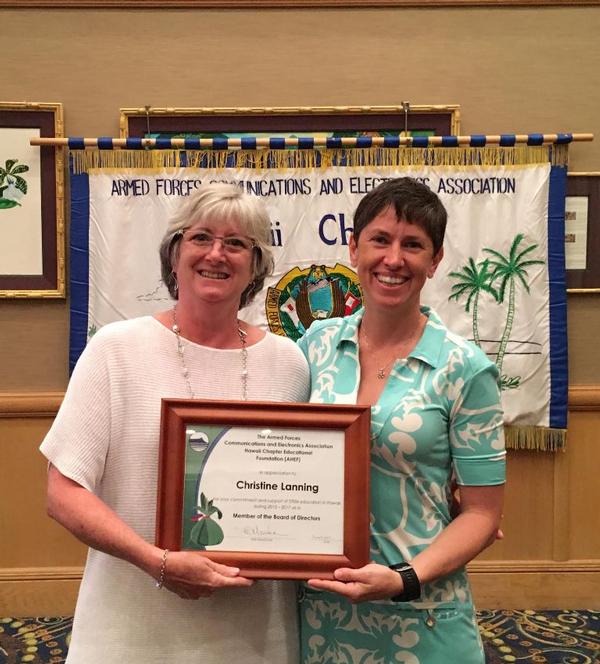 At the chapter's meeting in June, Linda Newton (l), board member of the AFCEA Hawaii Education Foundation, presents Christine Lanning with a certificate of appreciation for serving as a board member with the Foundation.