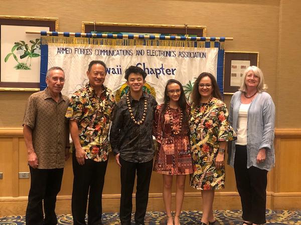 The AFCEA Scholarship Award Winner, Lucas Chun (c), and family, pause for a photo with Bloom and Linda Newton (far r), chapter executive vice president, at the May event.