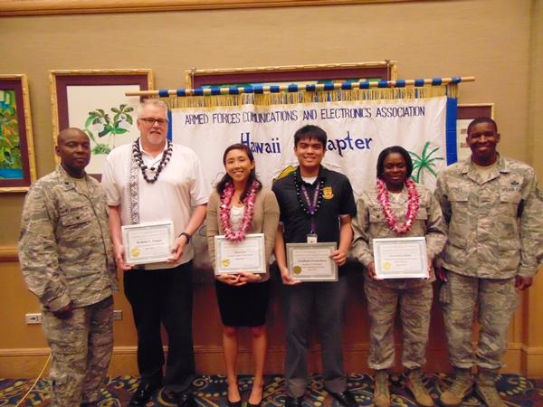 Col. Melbourne (l) honors May award winners, including (from 2nd from l) Executive of the Month Robert 