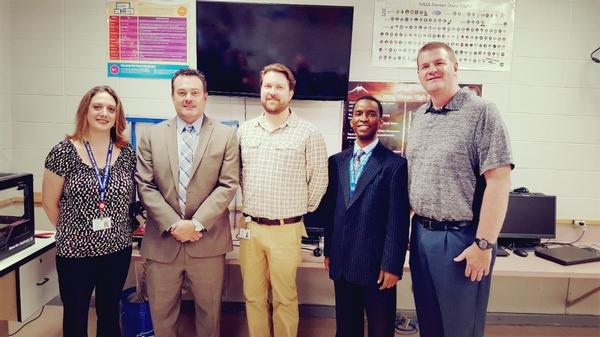 The chapter's vice president of education, Phil Nivens (2nd from l), presents grants for a cloud server and hardware and software in May to Hazel Green High School cybersecurity teacher Brandi Glenn; cybersecurity teacher Cameron Case; Allen Perkins, supervisor of instruction, Madison County schools; and Darrell Long, principal. 