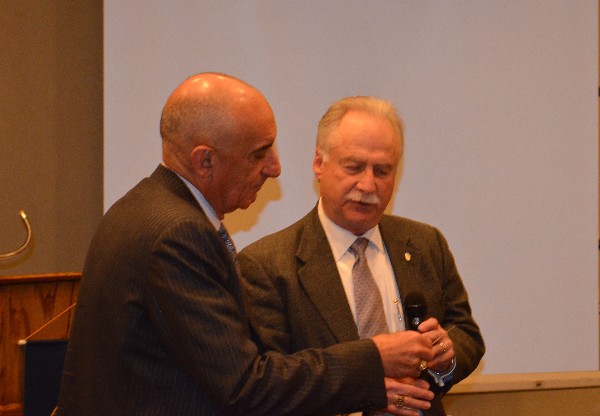 Michael Schexnayder (r), chapter president, presents Gen. Cuviello with a gift to his preferred charity in recognition of his presentation to the chapter in March.