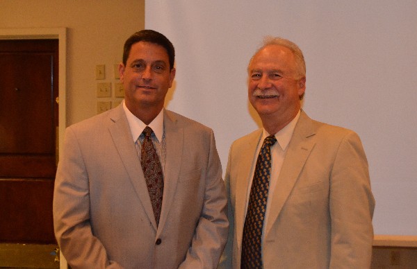 Chapter President Michael Schexnayder (r) meets Troy Trulock, the mayor of Madison, Alabama, and retired Army colonel who spoke at the August luncheon.