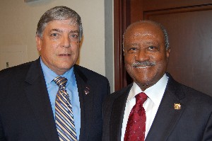 Vic Budura (l), chapter president, welcomes James H. Melancon, a guest at the September meeting.
