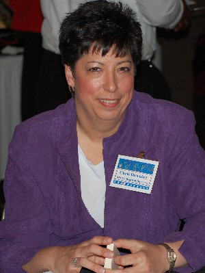 Christine Downing, chapter chairman for programs,  helps check in guests during the chapter's Member Appreciation Social, held in January.