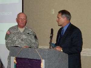 Maj. Gen. John Urias, USA (r) presents guest speaker Maj. Gen. Michael R. Mazzucchi, USA, with a token of appreciation from the chapter for his presentation on Army network strategies in June.