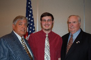 Vic Budura (l), chapter president, and Tom Gwaltney (r), regional vice president, present Nicholas Christensen with an AFCEA International Educational Foundation Science Fair Award at the September meeting.