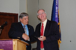 Marty Kress (r), executive director, National Space Science and Technology Center, receives a token of appreciation from Budura for speaking at the September meeting.