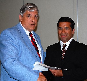 In June, Isaac Detrinidad (r) is recognized for his unprecedented fourth win of the chapter's War Veterans' Scholarship by Budura.