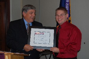At the chapter's September meeting, Budura (l) presents James Burk with the 2008 AFCEA Professional of the Year Award, offered on behalf of the Huntsville Association of Technical Societies.