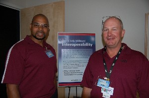 Bob Bell (r), director, Technology Initiatives, Applied Data Trends, and chapter membership chairman, and Marc Harris, senior staff engineer, Applied Data Trends, provide vendor product information to the June symposium's attendees.