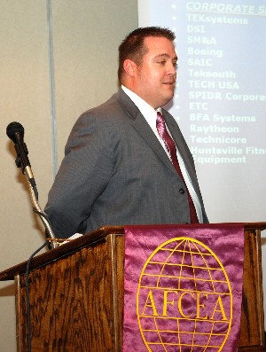 Jeff Edwards, chapter chair for social programs, thanks the sponsors of the chapter's golf tournament at the November meeting.