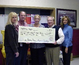 Ruth Fleming (l), chapter secretary; Shelley Decker, chapter treasurer (r); and Kevin Conley (2 from r), chapter president, award the Science Teaching Tools check to Gary Nelson (2 from l), Washington Elementary School principal; and Brandy Schurbon, Washington Elementary 4th Grade teacher. 