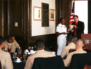 Petty Officer Alicia N. Davis, USN, Naval Communication Station accepts the award as Outstanding Industry Professional of the Month in Information Technology from Robert Whitkop, chapter president, at the November meeting.