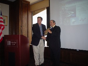 Whitkop (l) thanks the newest corporate member in March with a certificate for Bob Sheaves, USCG (Ret), chief financial officer of CTI Resource Management Services, Inc. 