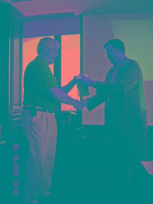 Capt. Whitkop presents Klugewicz with chapter mementos in appreciation for his visit at the May luncheon.