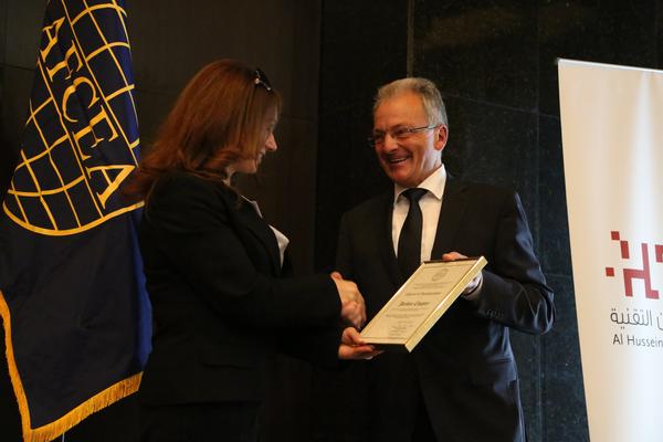 Gen. Staudacher presents the Charter of Incorporation to Eng. Ammuri at the chapter's inauguration event in July. 