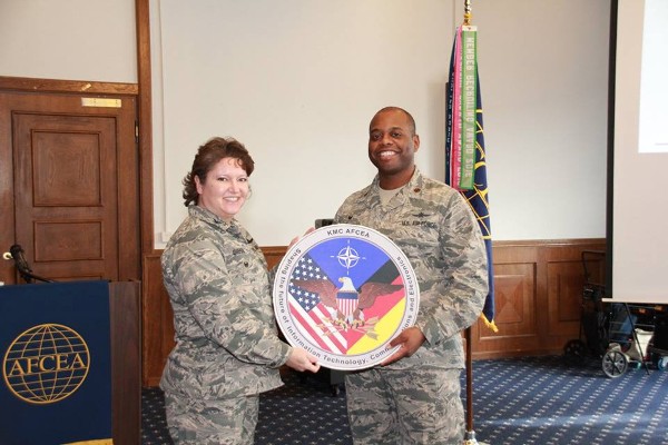 Chapter President Col. Robin Gibson, USAF, honors January guest speaker Maj. Eddie Edwards, USAF, commander of the 1st Air and Space Communications Operations Squadron (1 ACOS).
