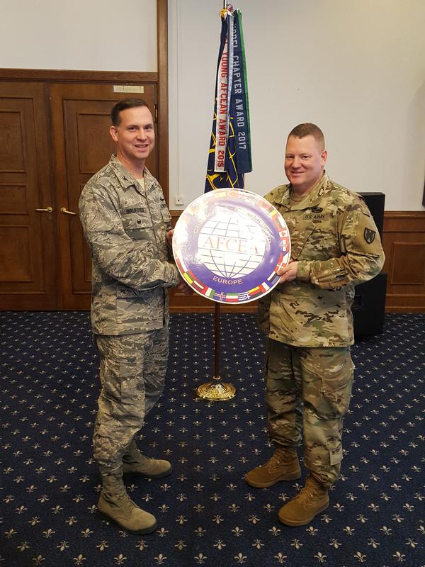 Lt. Col. Keith Hockman, USA, chapter vice president (r), presents a token of appreciation to January guest speaker Col. Neal Bruegger, USAF, commander, NATO Communications and Information (NCI) Agency Communications and Information Systems Support Unit (CSU) Ramstein.