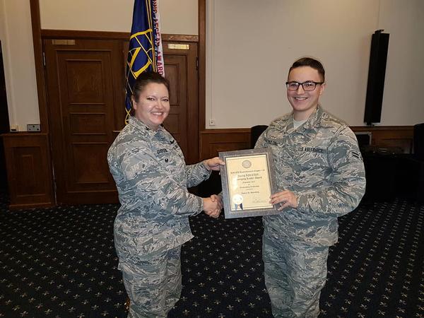 Airman 1st Class Ian Spaulding, USAF, receives the chapter's Emerging Leader Award at the December luncheon.