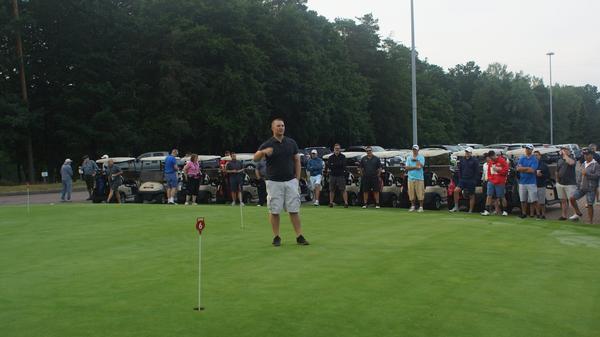 Master Sgt. Heath Curless, USAF (c), greets the players and covers the tournament rules for the July event.  