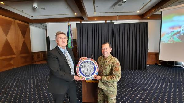 Pauls receives a chapter token of appreciation for speaking at the November event.