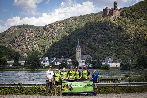 Participants pose for a photo in front of the Rhein River during the July event.
