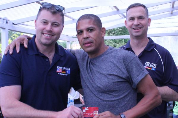 Sgt. Giddings (l) pauses for a photo with Michael Young of Verizon (c) and Col. Neal Bruegger, USAF, chapter president, during July's Young AFCEAN Kickoff event.