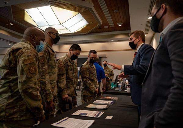 Attendees from Nellis Air Force Base discuss technology with vendors at the Tech Show in October.