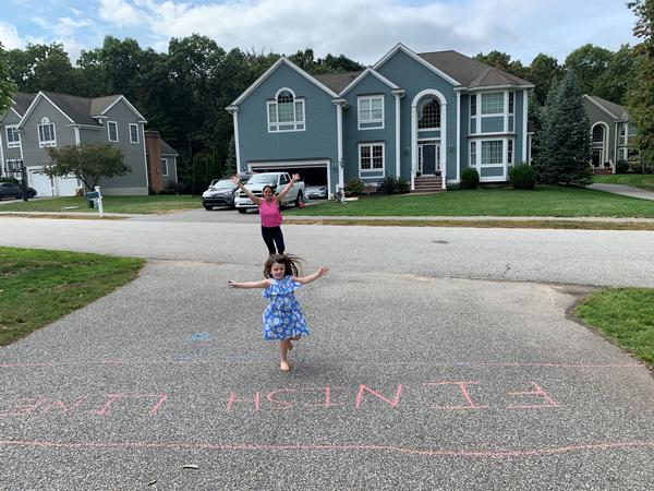 In September/October, Stephanie Ricciardi (in back) and her race buddy happily cross their finish line in this year's virtual 5K Run for STEM. (Photo is a winner in the race's  "Best Picture"  category).